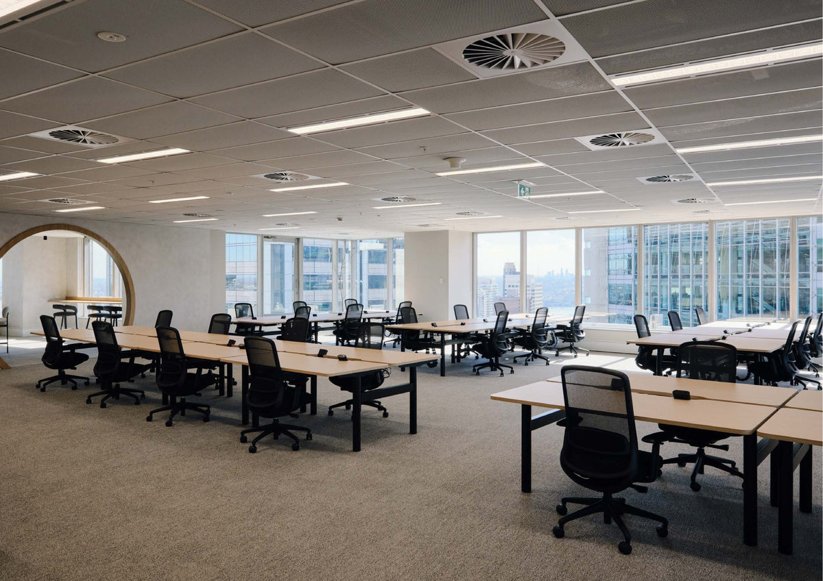 Rows of Kyoto task chairs at bench workstations beyond a circular timber portal, Mirvac 400 George Street, Sydney