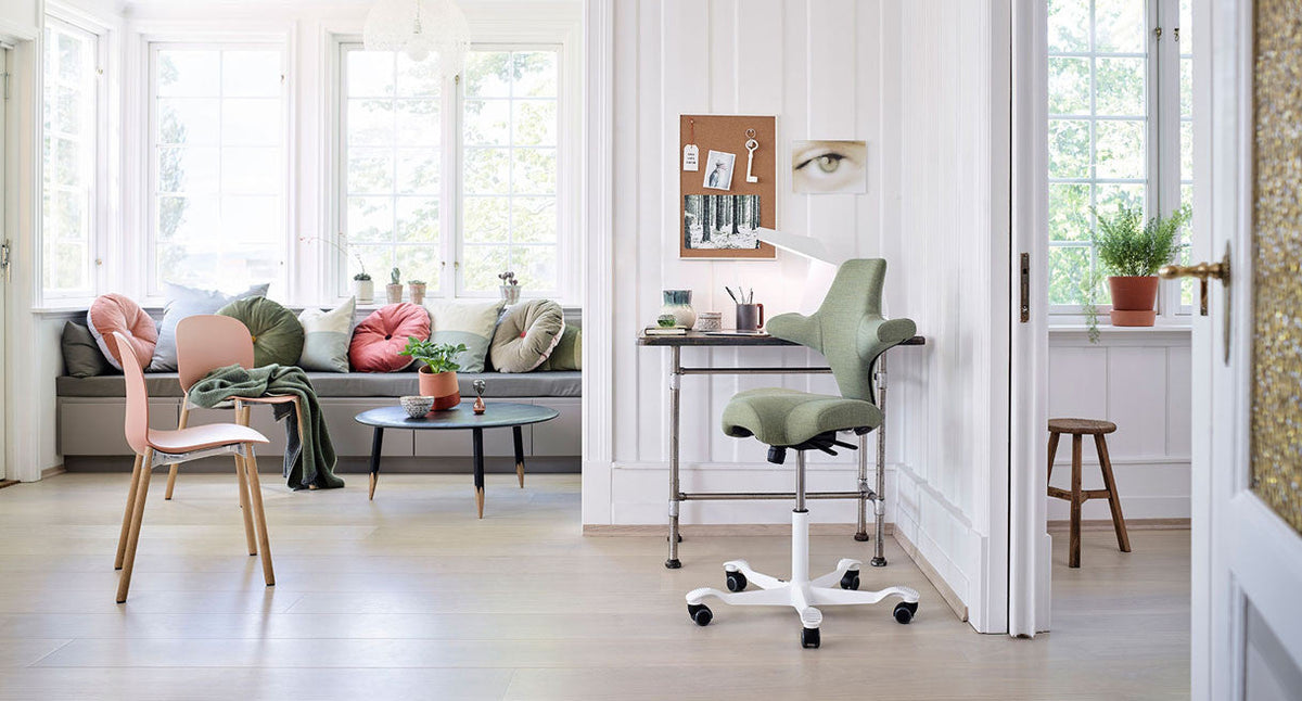 HÅG Capisco saddle chair in a modern office workspace