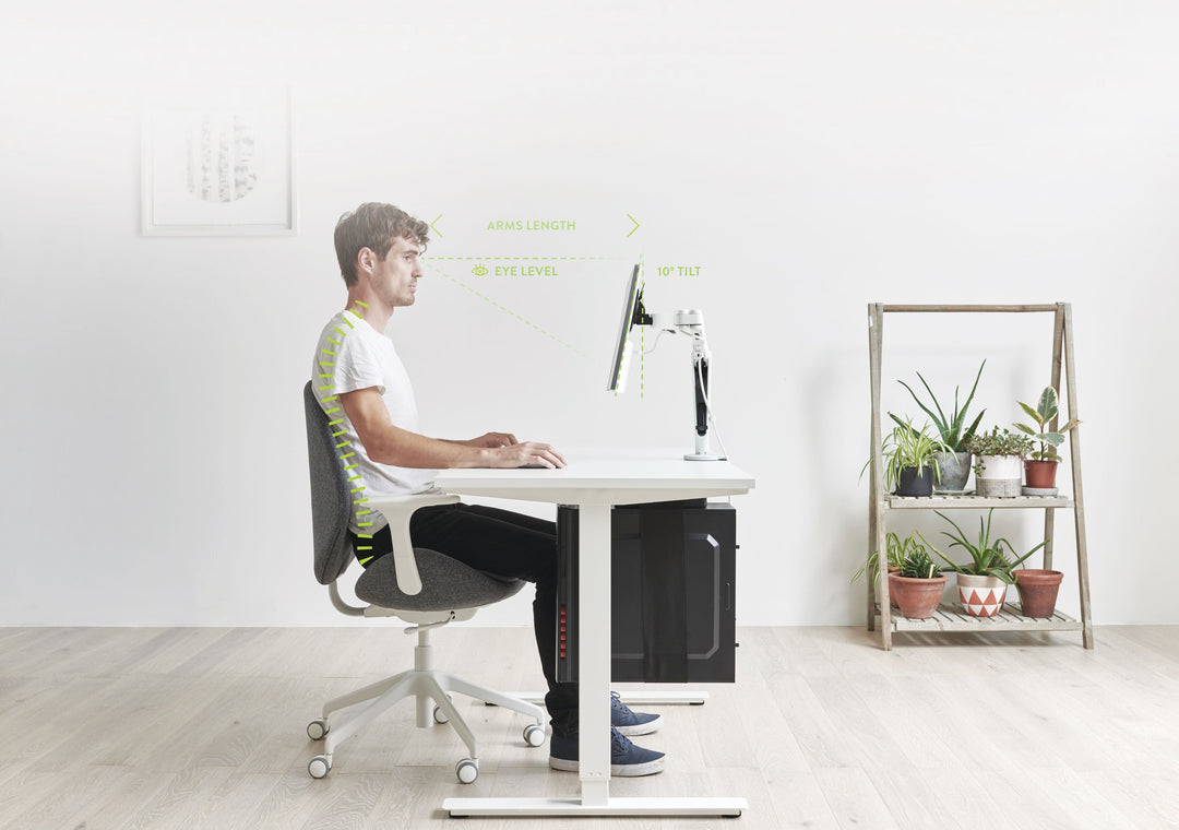 A workspace using a Colebrook Bosson Saunders Ollin monitor arm at screen height (Colebrook Bosson Saunders photograph)
