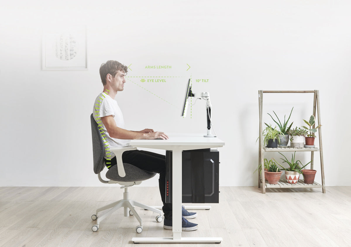 A workspace using a Colebrook Bosson Saunders Ollin monitor arm at screen height (Colebrook Bosson Saunders photograph)