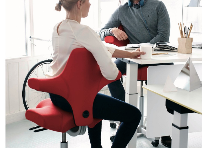 Peter Opsvik's iconic HAG Capisco chair in a modern workspace setting - Chair Dinkum