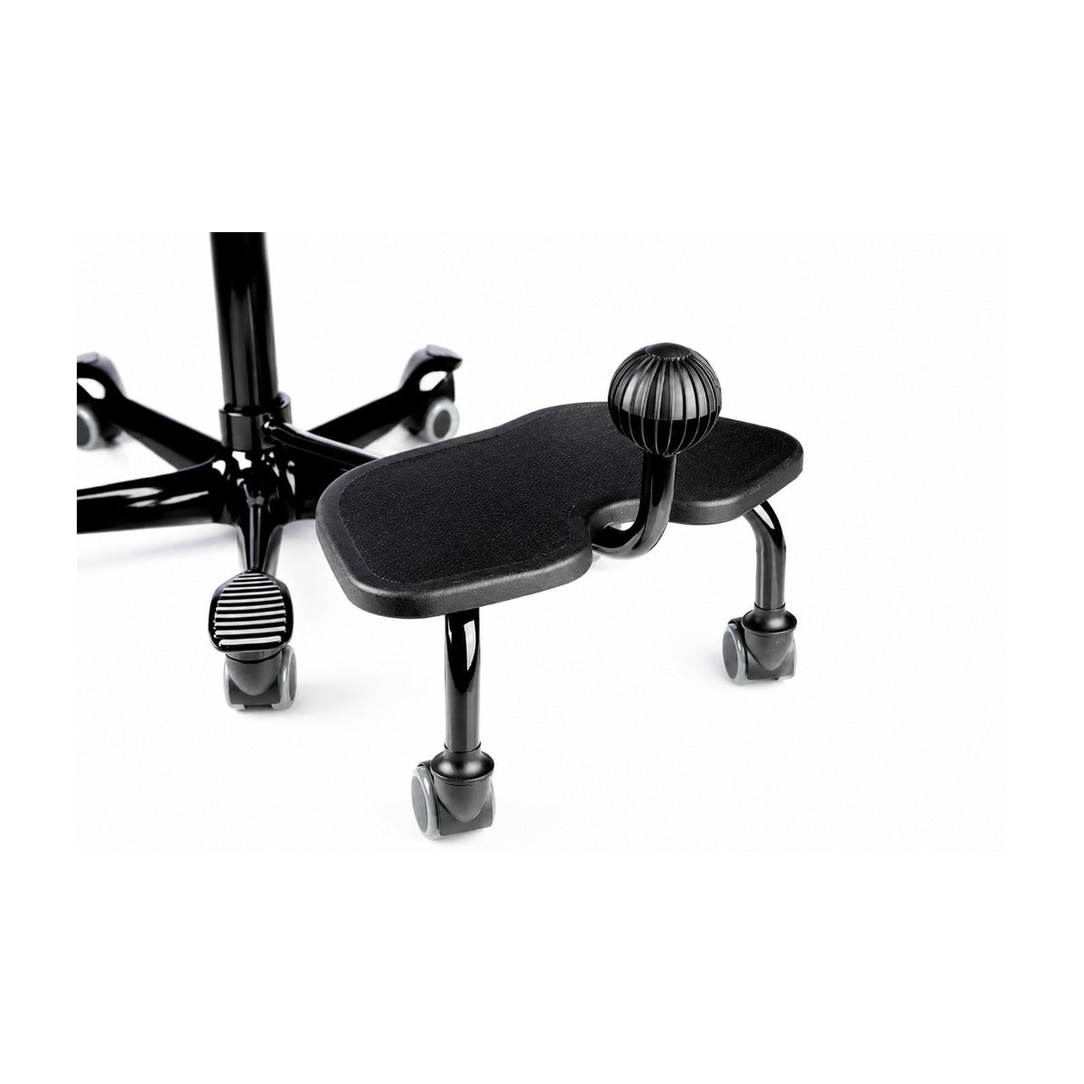 Ergonomic desk accessories including footrest and monitor arm in home office setup