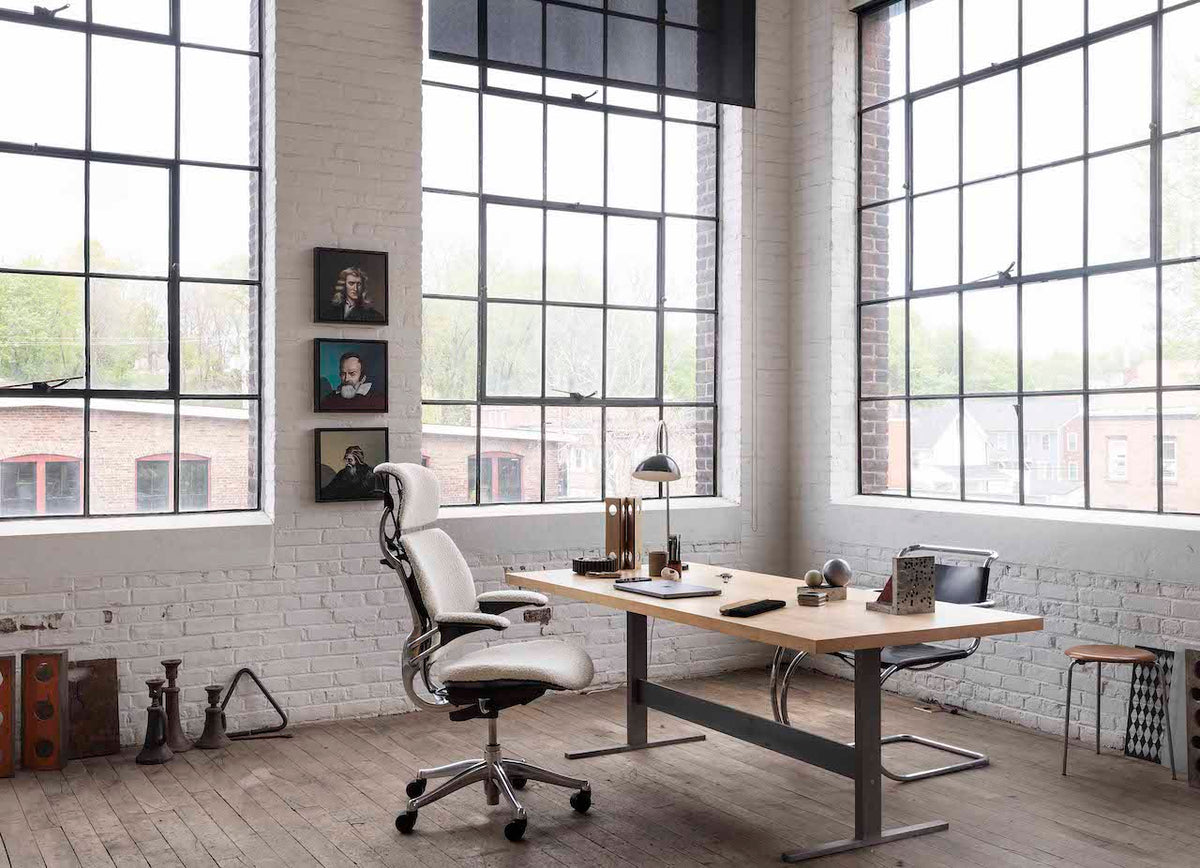 Humanscale Freedom chair at a desk in a bright open workspace