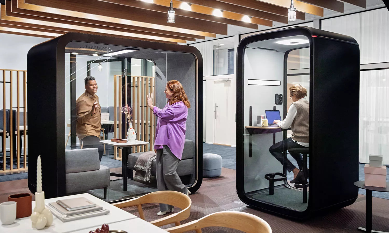 People working in Framery soundproof office pods