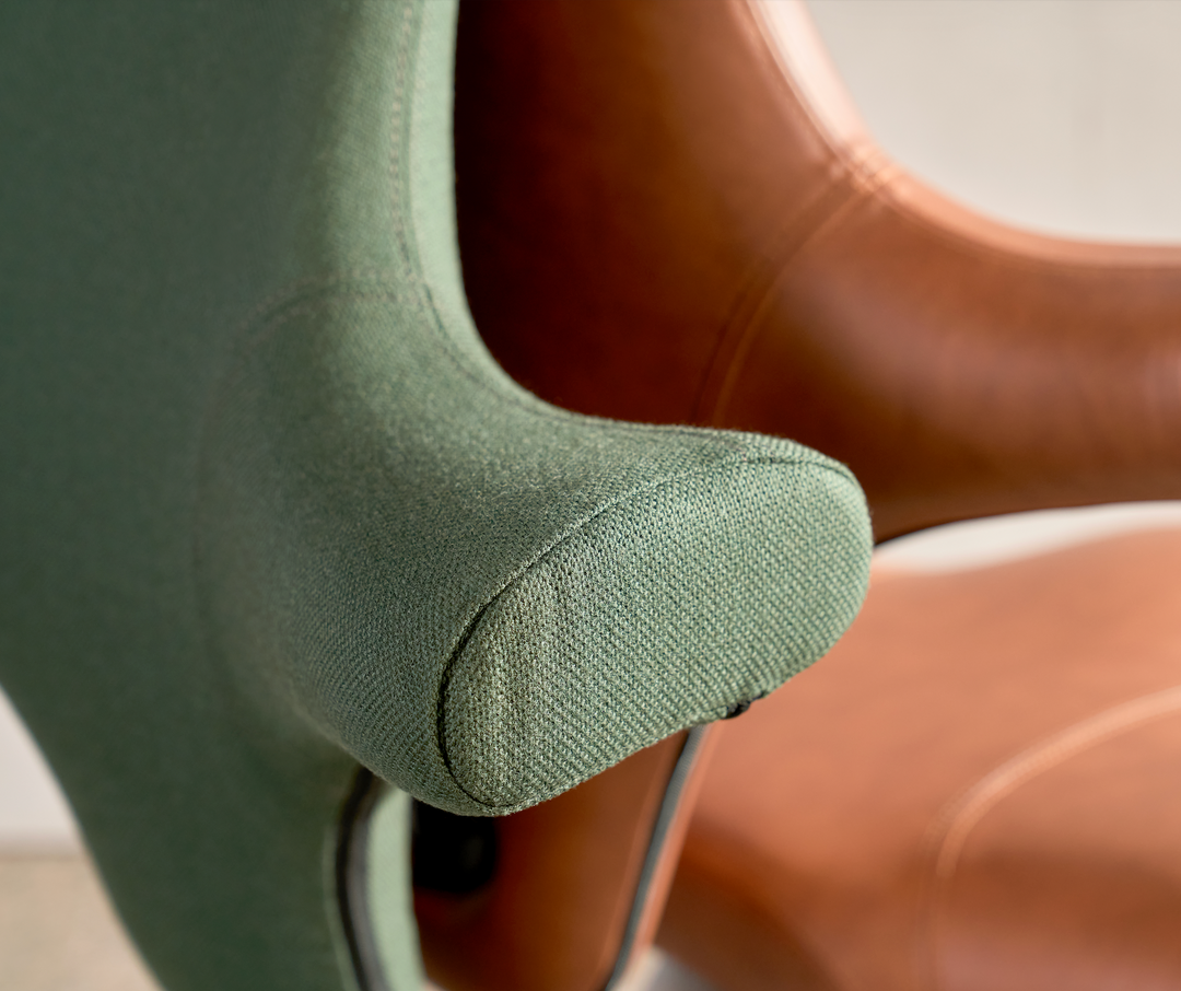 Ergonomic task chairs including HAG Capisco and Herman Miller Aeron at height-adjustable desks in a modern Australian office - Chair Dinkum