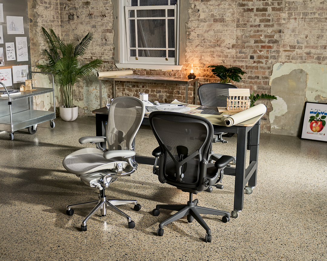 Herman Miller Aeron chairs at a sit-to-stand desk in a creative office - Chair Dinkum Australia