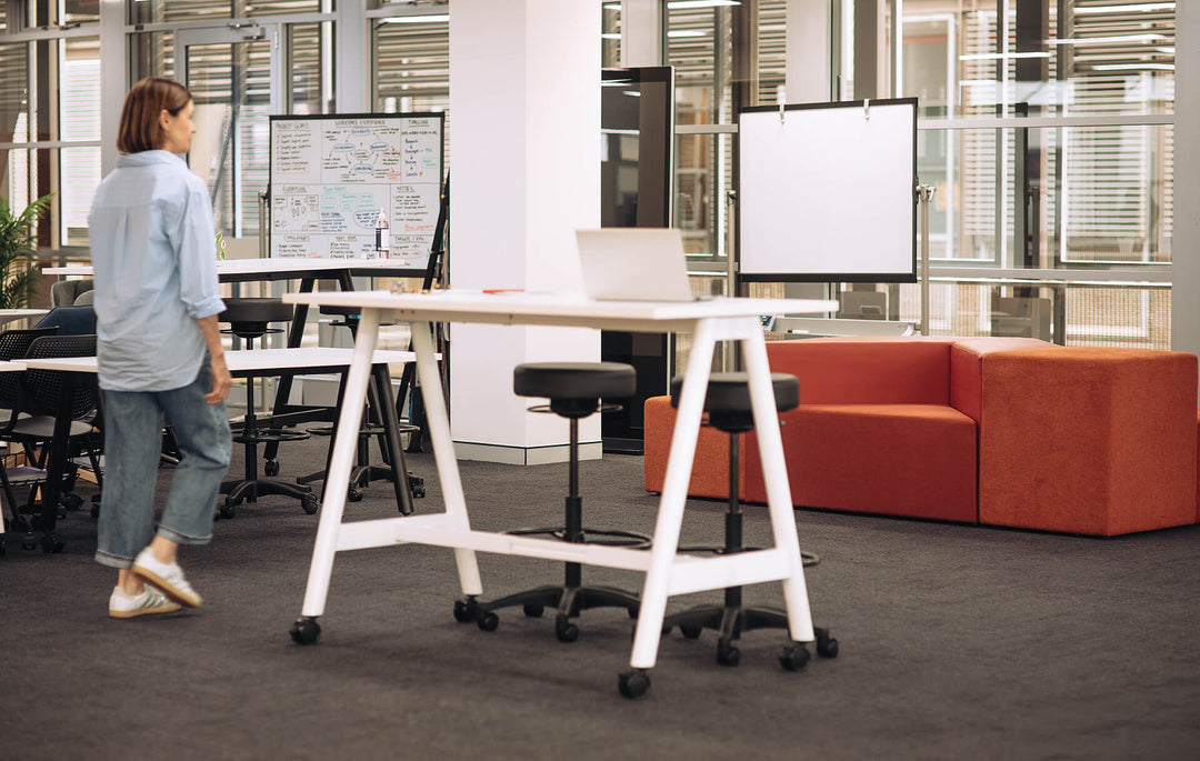 Buro MyWorkSpace A-Frame high training table with white frame used for a standing workshop in an open-plan office