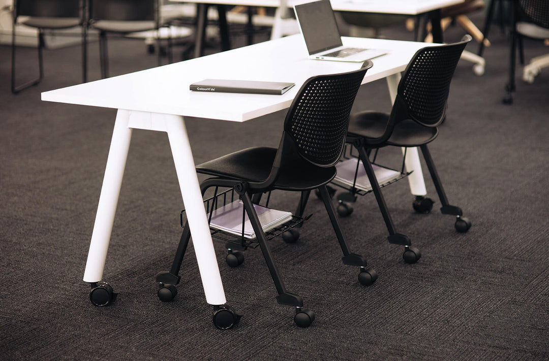 Buro MyWorkSpace A-Frame training tables with white frames set up in a training room