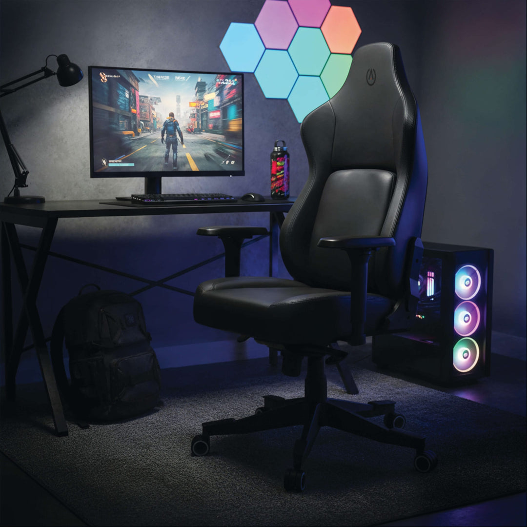 Buro x PowerA Navigator gaming chair at a gaming desk with monitor and lit PC