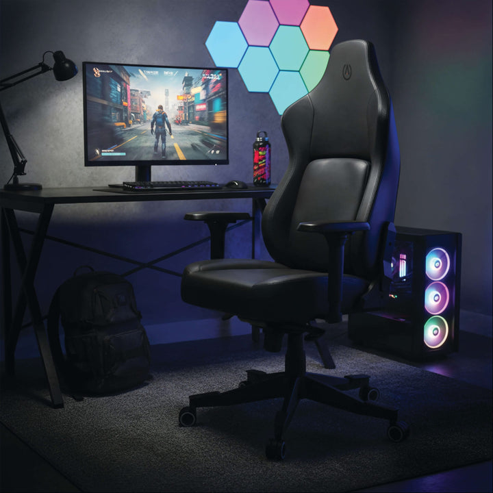 Buro x PowerA Navigator gaming chair at a gaming desk with monitor and lit PC