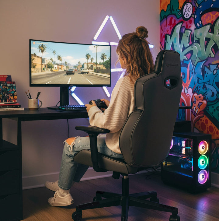 Woman gaming on a Buro x PowerA Raider gaming chair, rear angle