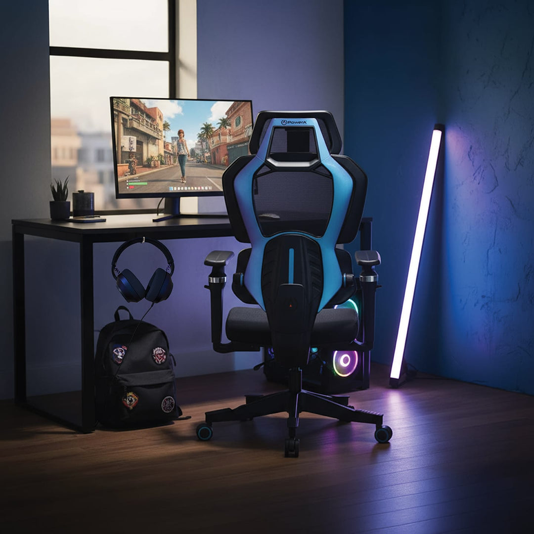 Buro x PowerA Sentinel gaming chair at a gaming desk in a dark room, rear view