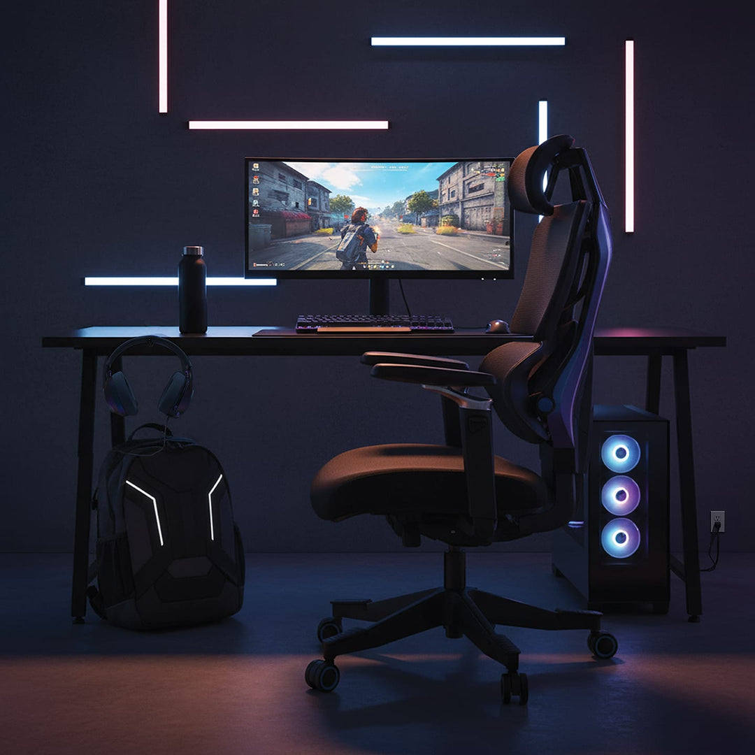 Buro x PowerA Sentinel gaming chair at a gaming desk with monitor and PC, side view