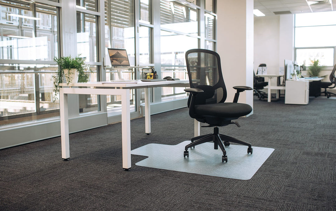 Buro Quantum mesh office chair with arms at a white desk in an office