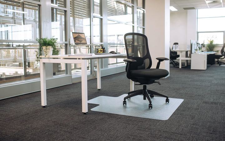 Buro Quantum mesh office chair with arms at a white desk in an office