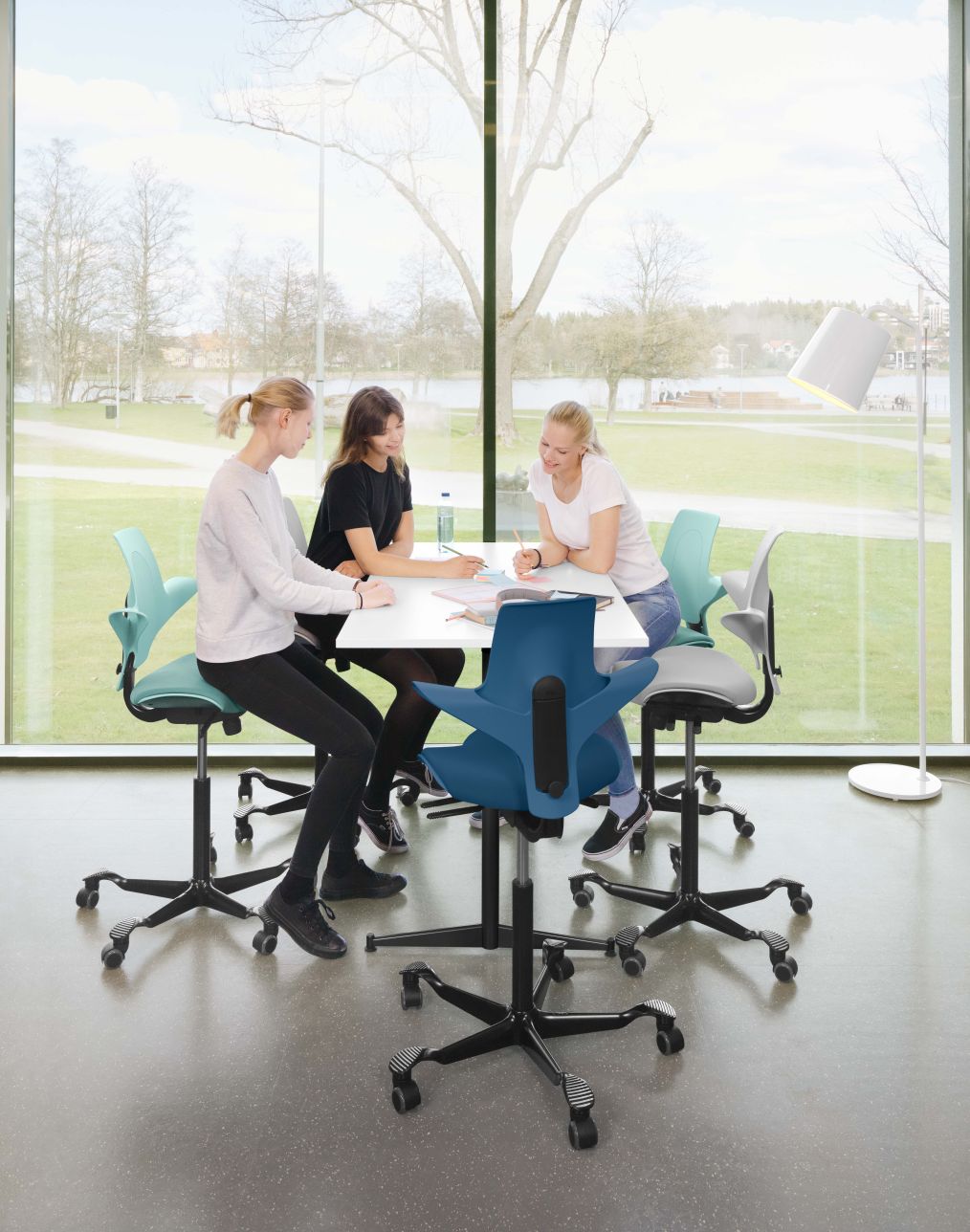 HAG Capisco Puls 8020 chairs in modern collaborative workspace - Chair Dinkum Australia