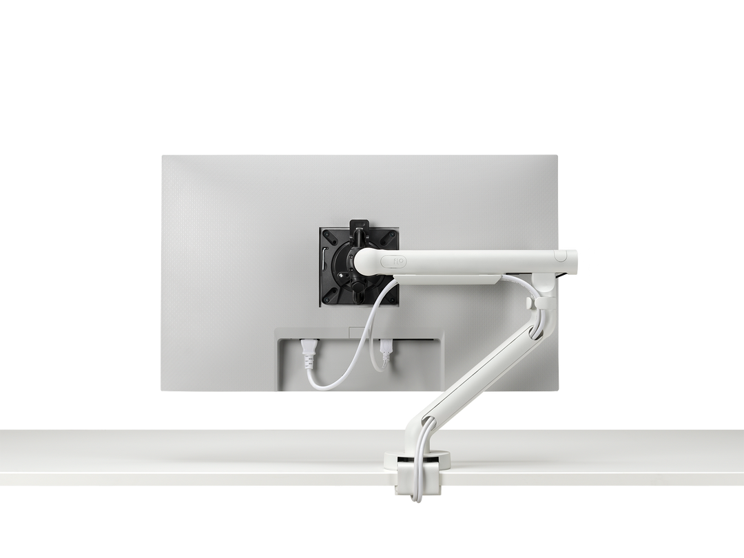 Close-up of the three-point cable management on a white CBS Flo monitor arm (Colebrook Bosson Saunders photograph)