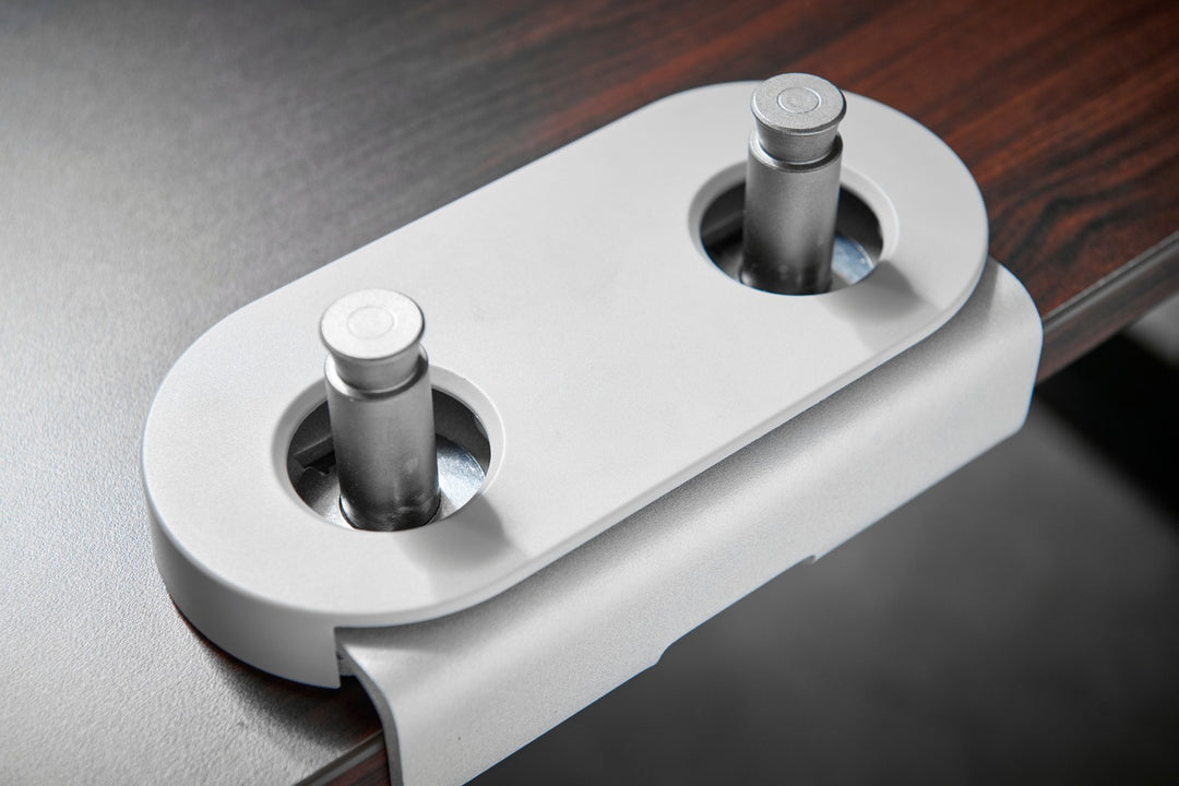 Close-up of the CBS Flo Dual dual-mount clamp in silver, with its cover fitted around the two arm posts - Chair Dinkum Australia