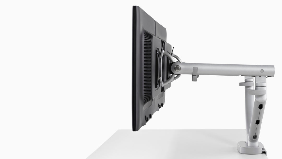 Side profile of a CBS Flo Dual monitor arm in silver carrying two screens, studio - Chair Dinkum Australia