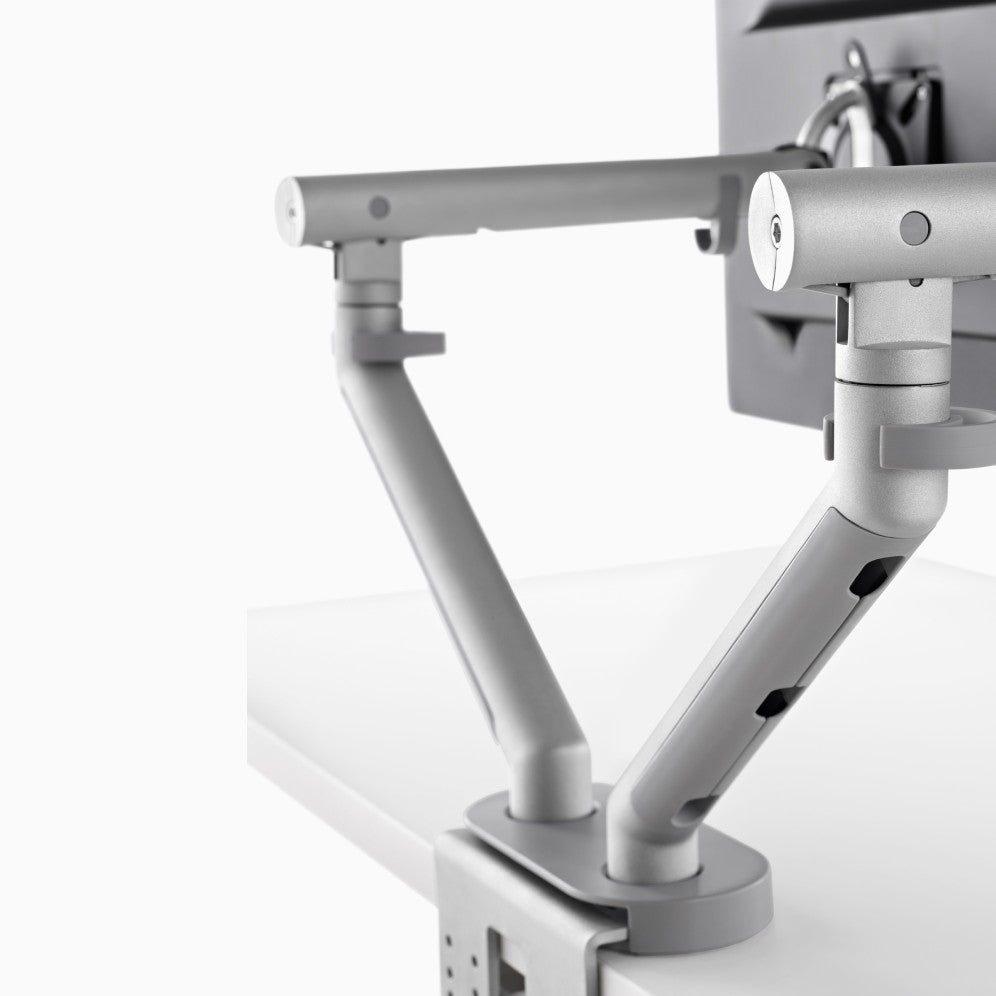 CBS Flo Dual arms in silver forming a V from one dual clamp and cover, behind two screens - Chair Dinkum Australia