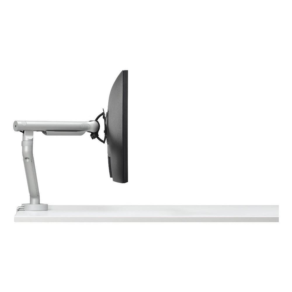 One of the two Colebrook Bosson Saunders Flo arms supplied in this set, silver, holding a screen at a desk edge, white background (CBS photograph)