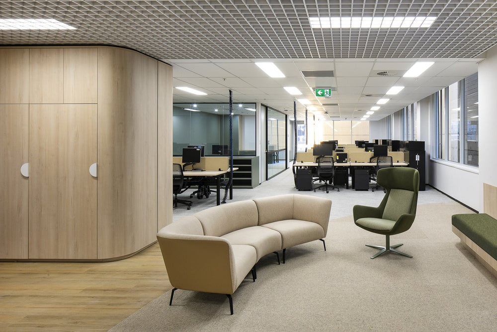 Curved lounge seating between workstation areas in the Dymocks workplace on George Street, Sydney