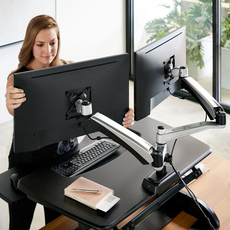 Dual monitor arm setup being adjusted by a professional - Chair Dinkum Australia