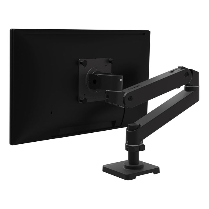 Ergotron LX Pro Desk Monitor Arm in matte black holding a screen, rear three-quarter view