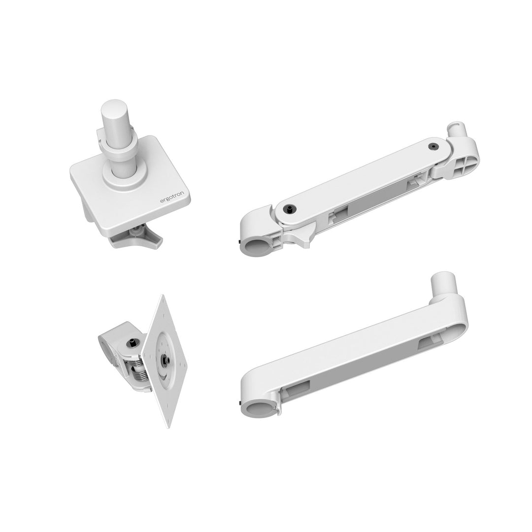 The parts of a white Ergotron LX Pro Desk Monitor Arm laid out: base and pole, arm, extension and monitor pivot