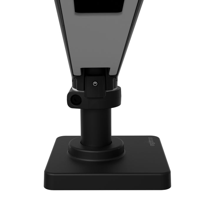 Rotation stop on the desk base and pole of a matte black Ergotron LX Pro arm