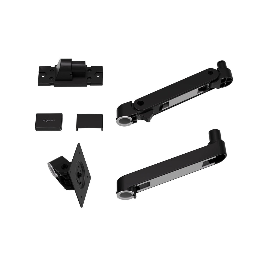 The parts of a matte black Ergotron LX Pro Wall Monitor Arm laid out: wall base, arm, extension and monitor pivot