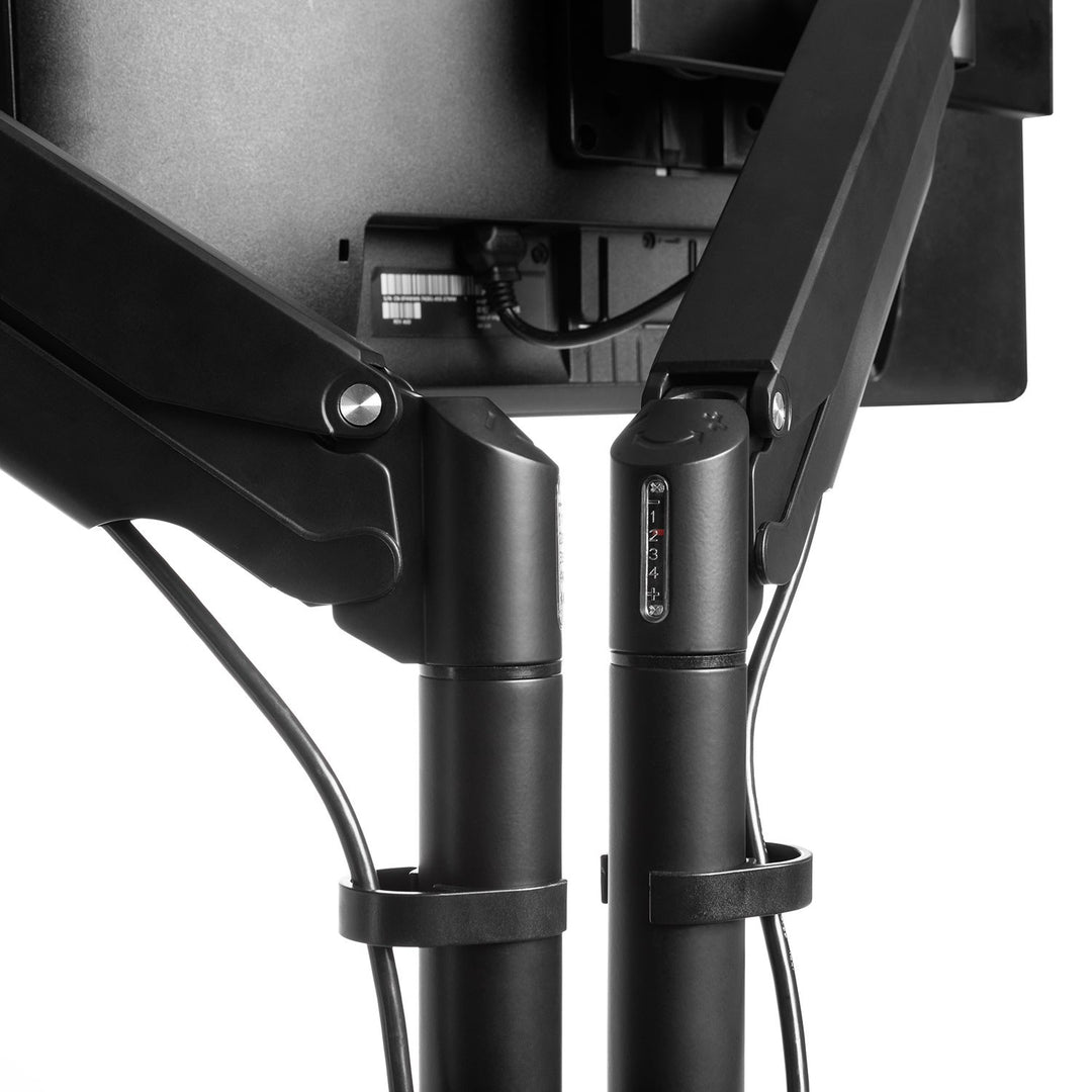 Close-up of the pole and tension adjustment on a black HAT Collective E2 dual monitor arm