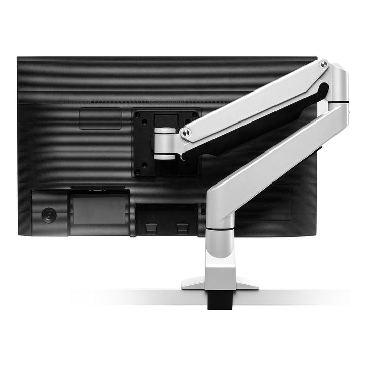 Rear view of a white HAT Collective E2 single monitor arm folded in behind a monitor