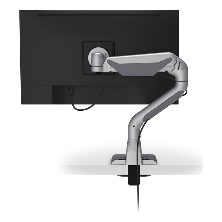 Rear view of a HAT Collective E5 single dynamic monitor arm in silver with cables routed through the arm