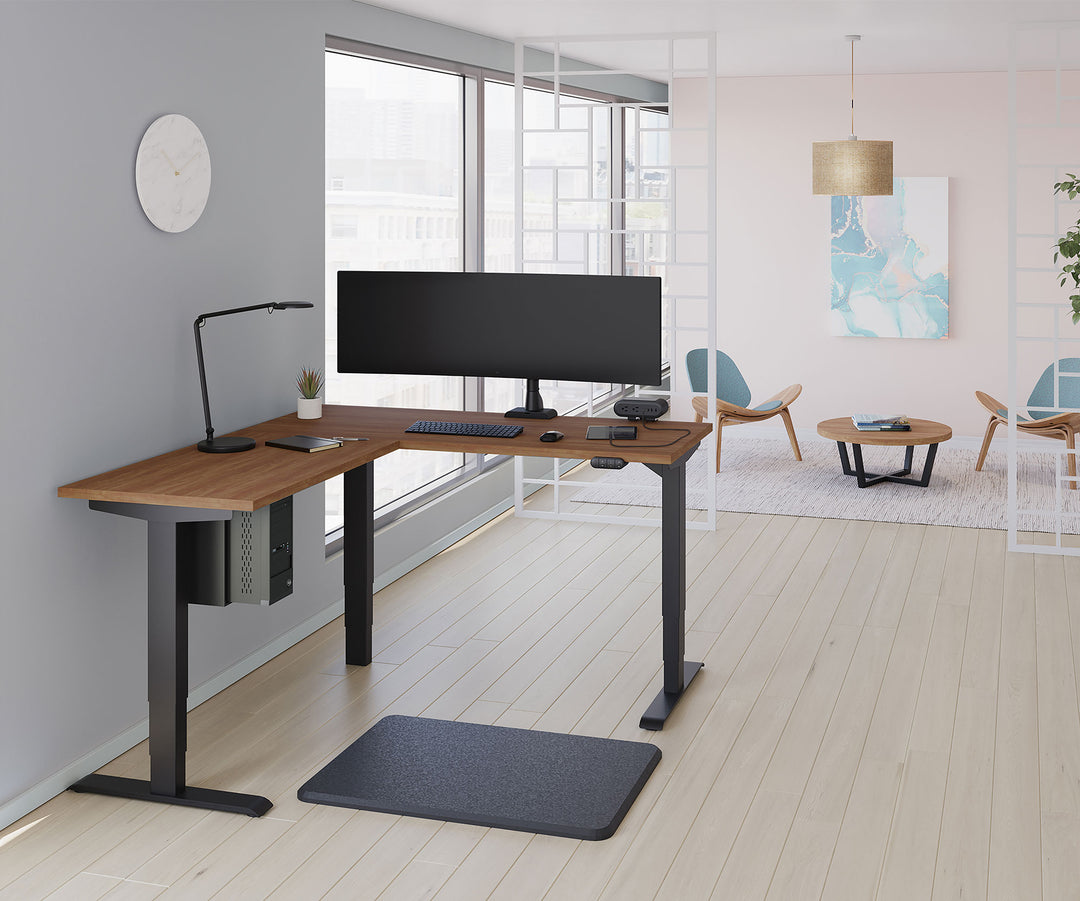 Private office with an ultrawide screen on a black HAT Collective E5 single monitor arm on an L-shaped desk