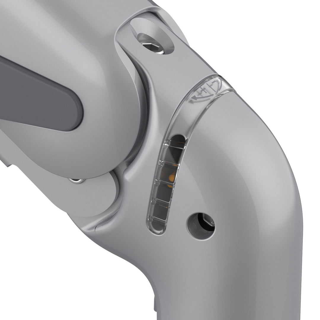 Close-up of the tension indicator window on a HAT Collective E5 monitor arm, silver finish