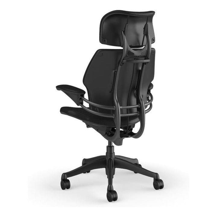 Humanscale Freedom Headrest Chair in Obsidian black Ticino leather with graphite frame, rear three-quarter view - Chair Dinkum Australia