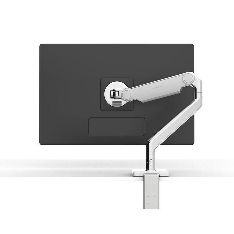 Humanscale M2.1 monitor arm in white with polished aluminium, holding a monitor, front view - Humanscale photograph