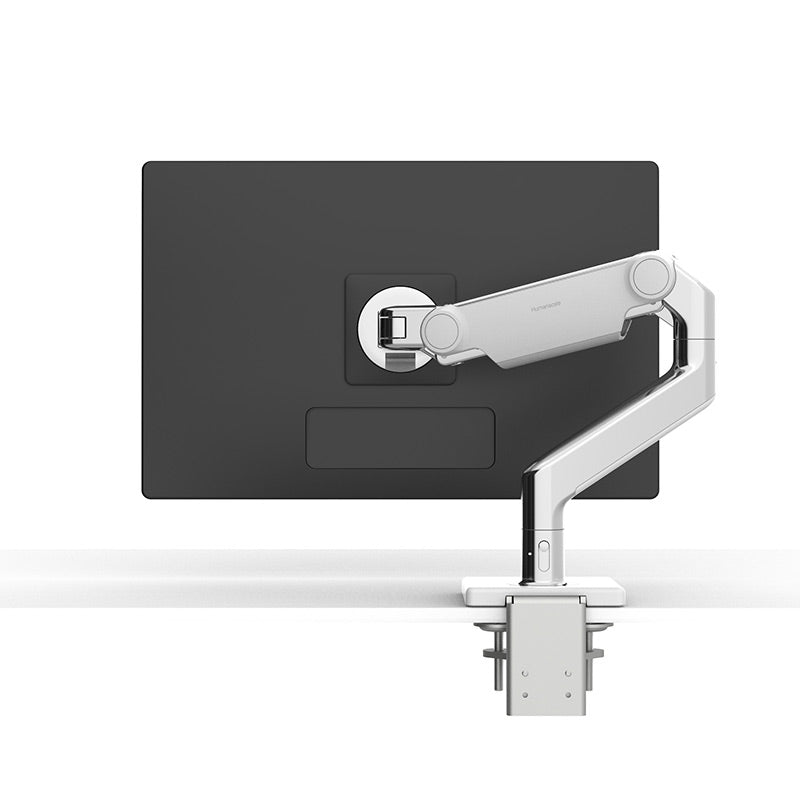 Humanscale M8.1 monitor arm in white with polished aluminium holding a monitor - Humanscale photograph