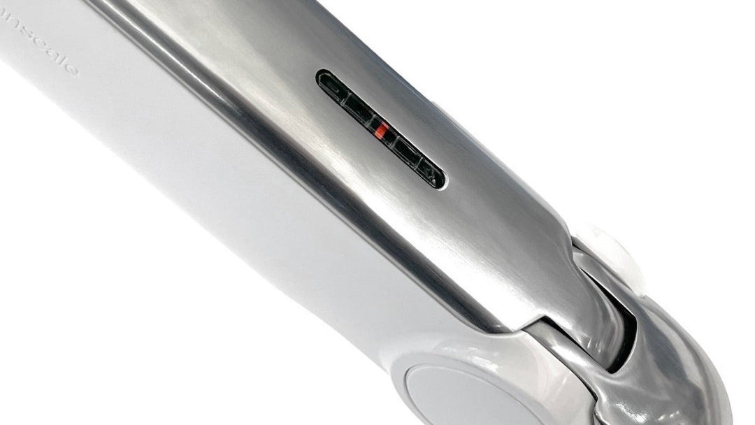 Counterbalance setting indicator on a Humanscale monitor arm, close-up (Humanscale photograph)
