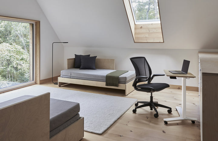 Humanscale World One LM chair with upholstered black seat at a height-adjustable desk in a timber-floored loft home office - Chair Dinkum Australia