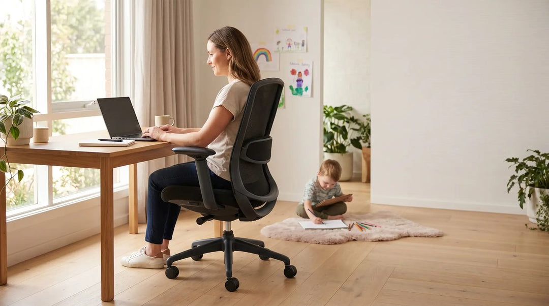 Mother working from home on Buro Kyoto chair with child playing nearby