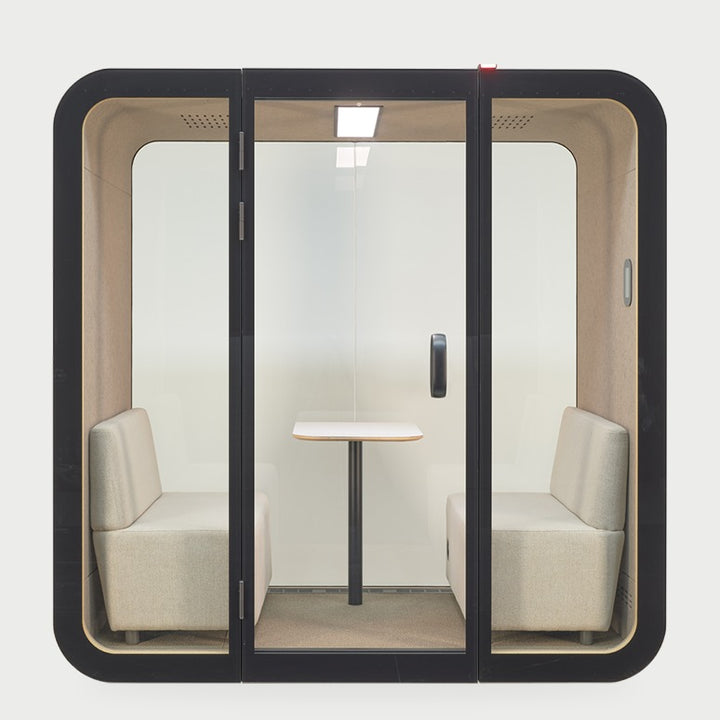 NUMO Meet four-person office meeting pod in black with two sofas and table | Chair Dinkum Australia