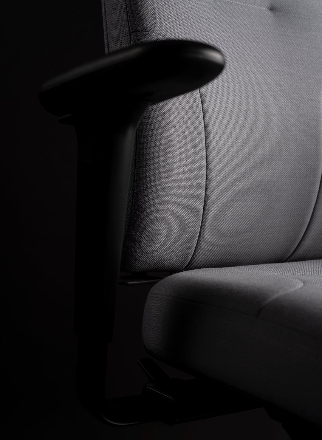 Close-up of an RH Logic 220 Elite armrest beside the padded seat and backrest - Chair Dinkum Australia