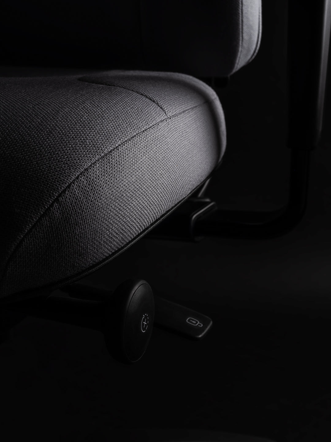 Close-up of the padded RH Logic 220 Elite seat edge with the adjustment levers beneath - Chair Dinkum Australia