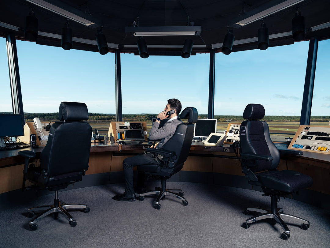 Air traffic control tower with three black RH Secur24 chairs at the console and an operator on the phone - Chair Dinkum Australia