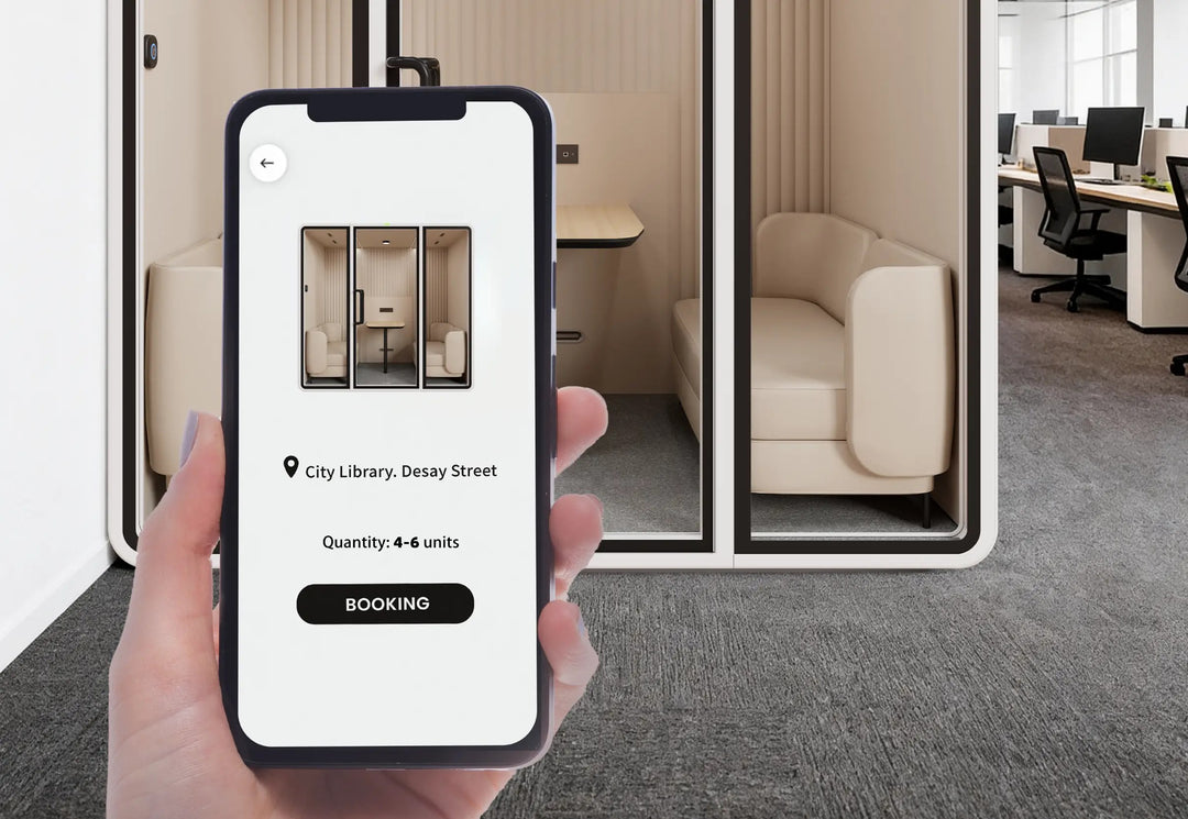 Phone showing the SoundBox app booking screen in front of a VRT meeting pod - Chair Dinkum Australia
