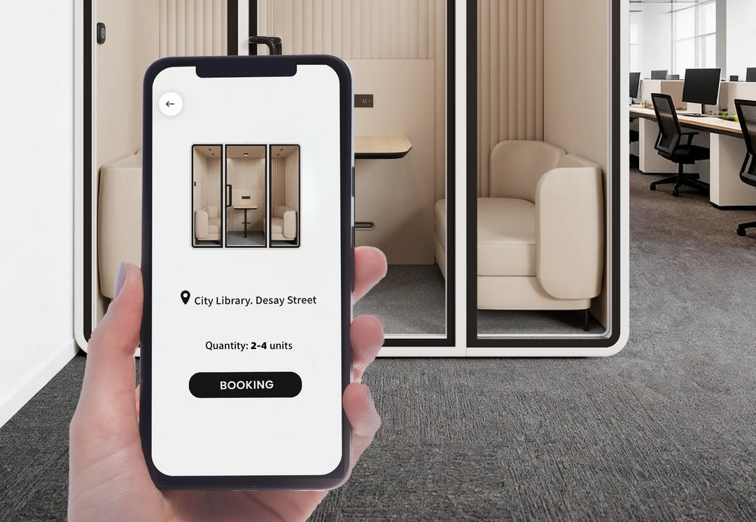 Phone showing the SoundBox app booking screen in front of a VRT meeting pod - Chair Dinkum Australia