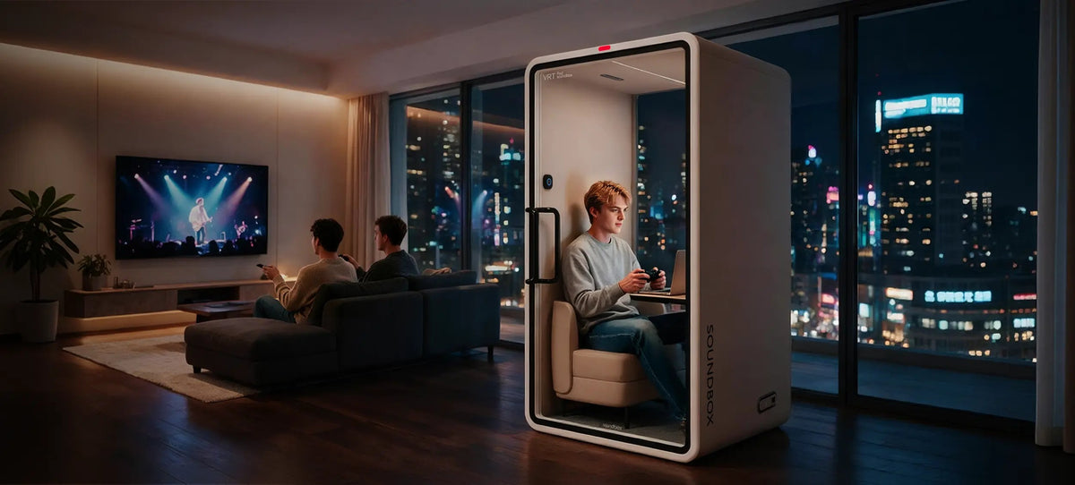 Man in the lounge seat of a SoundBox VRT pod in a living room at night, city lights outside - Chair Dinkum Australia - Chair Dinkum