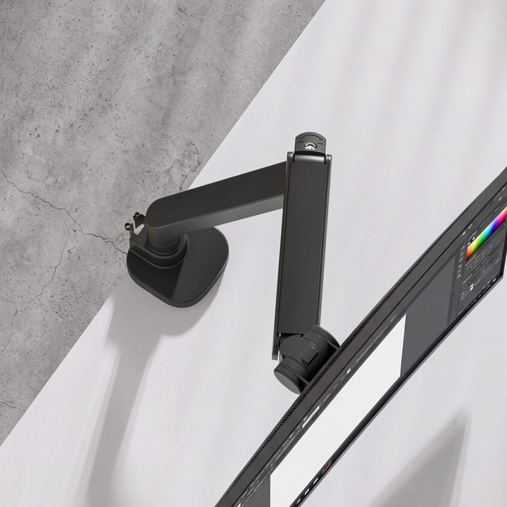Top-down view of a Thinking Works 2:22 Curve monitor arm and curved screen over a desk